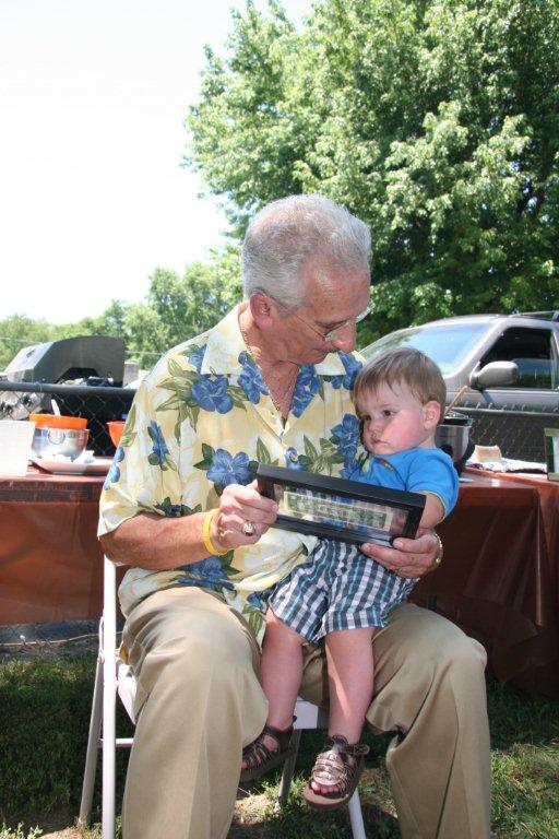 Photo of Al and Jack looking at dollar bill