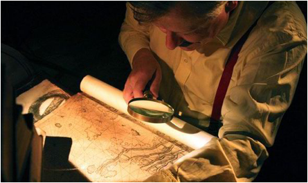 Description: A reconstruction of Herman Wirth looking at map for Atlantis
