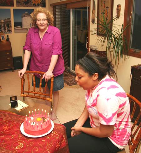 Ayanna blowing out her candles