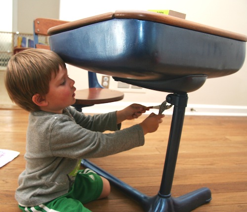 Jack on his own fixing his desk