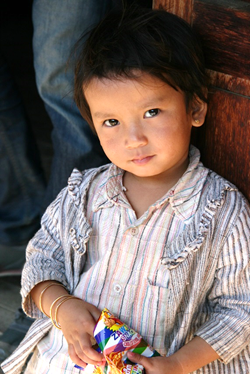 Burmese boy eating