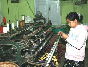 Burmese girl working