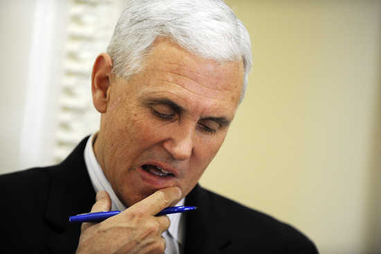 U.S. Representative Mike Pence (R-IN) looks at his notes before a news conference about the goal of permanently extending Bush-era tax rates at the U.S. Capitol in Washington December 2, 2010. Pence told reporters on Thursday his view on stripping the Fed