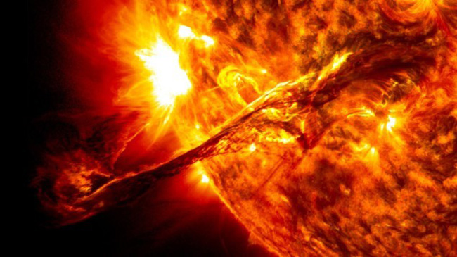 The coronal mass ejection is the large red arm-like ejection from the Sun.