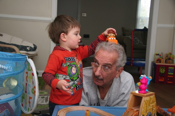 Jack drives his car on papa's gray Interstate highway.