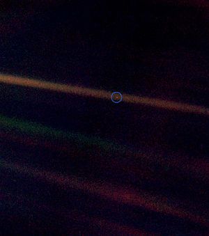 This photo was taken by Voyager 1 ...our home is on a Pale Blue Dot in the vastness of space.
