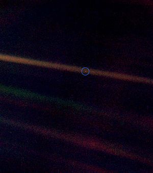 This photo was taken by Voyager 1 ...our home is on a Pale Blue Dot in the vastness of space.
