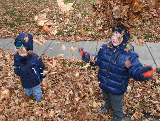 The two of them enjoy the falling leaves