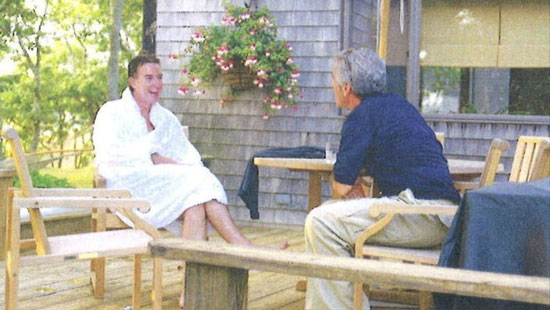 Mandelson, in the white bathrobe, chatting with “my best pal.”